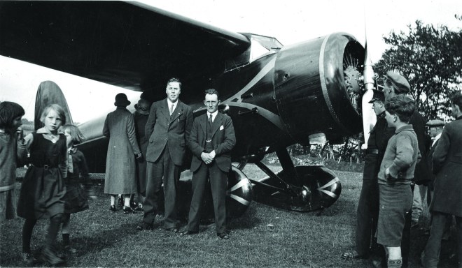 Sightseers surround the Earhart's plane, the Lockheed Vega, shortly after landing in an Irish field just north of Derry City. May 22nd 1932.